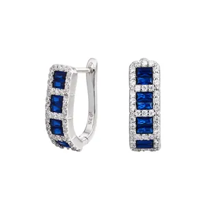 Detailed view of S925 sterling silver hoop earrings with baguette blue cubic zirconia