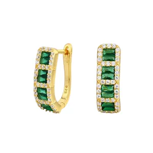Close-up of gold-plated S925 silver hoop earrings with emerald green cubic zirconia