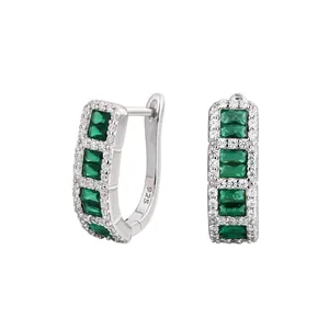 Close-up of S925 sterling silver hoop earrings with emerald green baguette zirconia