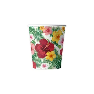 Detail view of a Hawaiian theme party paper cup with tropical hibiscus flower print.