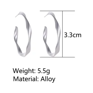 Detail view of twisted silver hoop earrings with 3.3cm height and 5.5g weight info
