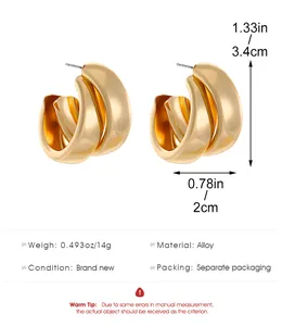Detailed view of chunky gold hoop earrings with dimensions, weight and material info.