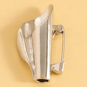 Close-up of silver mini vase lapel pin brooch for creative floral arrangements