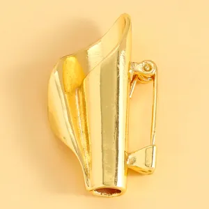 Detail view of a gold-finish artistic floral brooch with a unique funnel-shaped design.
