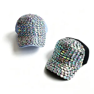 Close-up detail of handmade iridescent rhinestones on fashionable baseball caps.