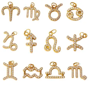 Ensemble de 12 pendentifs zodiaque dorés sertis de cristaux blancs étincelants