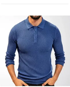 Close-up detail of men's blue knitted long-sleeve Polo shirt showing fabric texture
