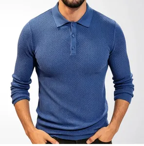 Close-up view of the intricate waffle texture on a blue long-sleeved knit shirt