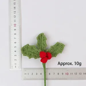 Handmade crochet Christmas holly berries branch with measurement rulers shown