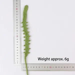 Detail view showing weight and length of handmade crochet flower stem