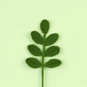 Detailed close-up showing the texture of a handmade green crocheted leaf stem for home.