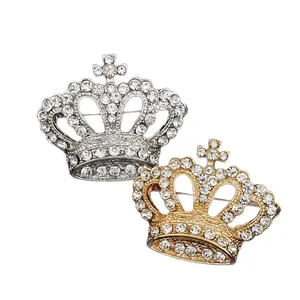 Luxurious crown brooches in gold and silver tones with shimmering rhinestones for suits