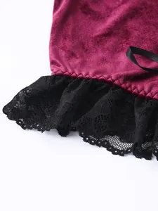 Close-up of gothic velvet camisole with delicate black lace trim and satin ribbon