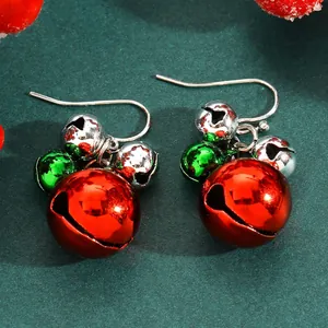 Close-up of festive Christmas bell drop earrings in red, green, and silver chrome finish.