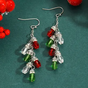 Close-up of festive Christmas light bulb dangle earrings with faceted beads
