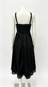 Back view of an elegant black French style midi dress featuring corset lace-up details