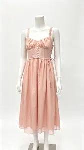 Front view of a pink French-style vacation midi dress with spaghetti straps on a mannequin.