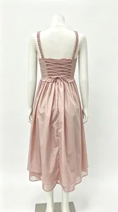Detailed back view of a pink French-style vacation dress with corset lace-up design