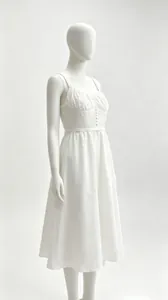 Side profile of elegant white French style midi dress with spaghetti straps on mannequin