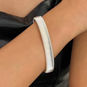Elegant silver three-line coiled spring cuff bracelet with a punk hip-hop aesthetic