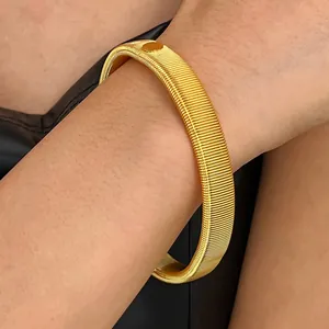 Gold-colored flexible spring metal bangle for punk style fashion