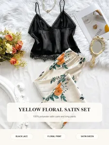 Detailed flat lay of women's floral satin pajama set with black lace camisole and pants