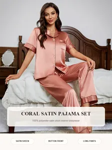 Elegant coral satin pajama set featuring short-sleeve button-down top and long pants.