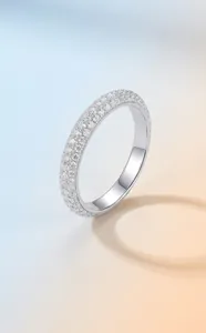 Macro detail of S925 sterling silver ring with pavé moissanite stones sparkle.