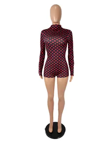 Women's slim fit long sleeve bodysuit with red polka dots on black background