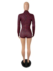 Back view of a red and black polka dot long sleeve bodysuit on a mannequin