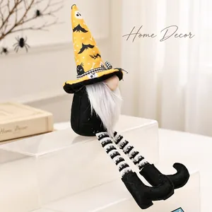 Close-up of a Halloween gnome decoration featuring striped long legs and a wizard hat.