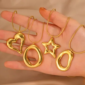 Detailed view of four gold-plated stainless steel pendants on elegant snake chains