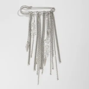Fashionable silver safety pin brooch featuring multi-layered tassel chains and cone pendants