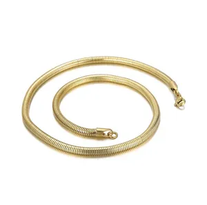 Macro detail of 18K gold plated titanium steel snake bone necklace in a spiral layout