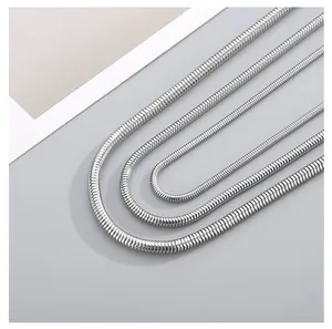 Detailed view of three different thicknesses of silver titanium steel snake bone chains
