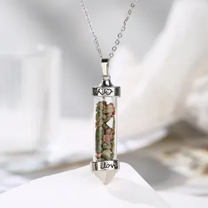 Detailed macro shot of a silver-toned pendant filled with natural crushed stones