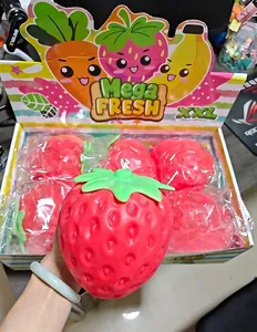 Close-up detail of a giant red strawberry flour-filled squishy toy for effective stress relief.