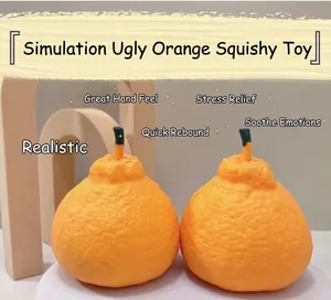 Detailed macro view showing the realistic skin texture of the tangerine stress relief toy.