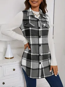 Close-up of a stylish grey plaid sleeveless shacket worn over a white sweater