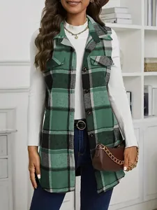 Detailed shot of a green and black plaid sleeveless wool vest worn over a white top