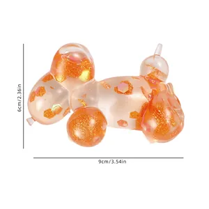 Detailed dimension view of orange glitter balloon dog squishy toy with hexagonal sequins
