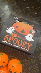 Detailed view of the Spooky Halloween pumpkin squishy toy packaging and festive ornaments