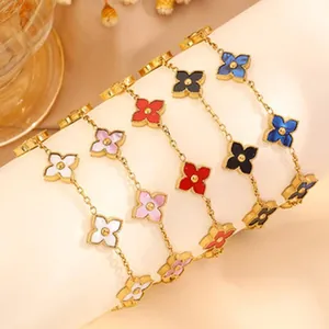 Close-up showing colorful four-leaf clover charms on gold-plated stainless steel chains