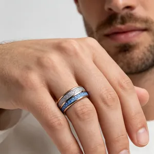 Detailed view of tungsten steel ring with rose gold, blue, and stone pattern bands