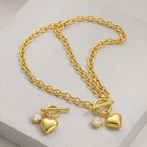 925 sterling silver gold heart pendant necklace with moissanite charm and toggle clasp.