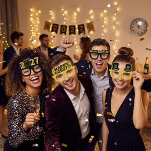 People celebrating 2027 New Year wearing festive black and gold paper glasses props.