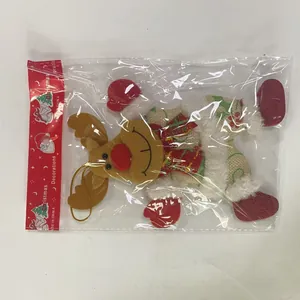 Detailed macro view of a plush reindeer Christmas ornament inside retail packaging bag