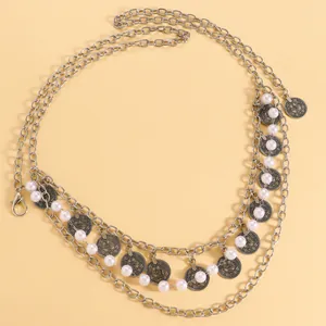 Detail of Bohemian multi-layer waist chain belt with retro metal coins and pearls