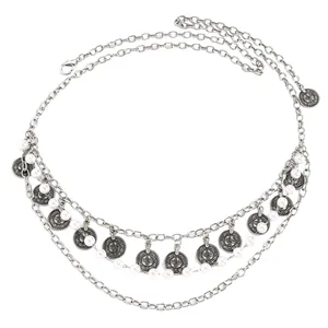 Detailed view of silver ethnic coin waist chain with faux pearls and lobster clasp