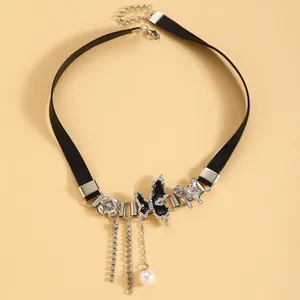 Detailed close-up of a Y2K black leather choker with silver butterfly and pearl charms